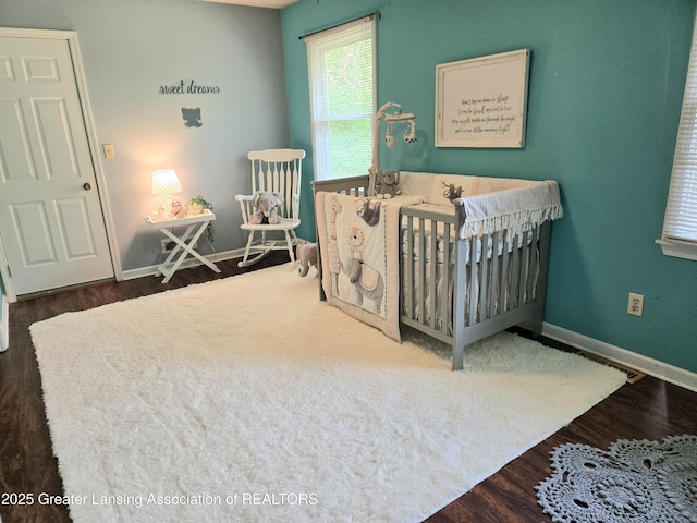 4423 Hyatt St, Eaton Rapids, MI 48827 - bedroom with wood finished floors and baseboards