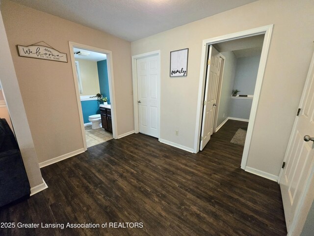 4423 Hyatt St, Eaton Rapids, MI 48827 - hall with wood finished floors and baseboards