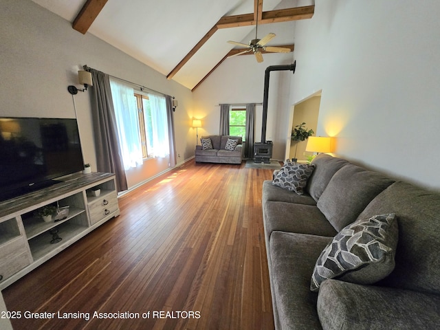 4423 Hyatt St, Eaton Rapids, MI 48827 - living room with beamed ceiling, a wood stove, high vaulted ceiling, wood-type flooring, and ceiling fan