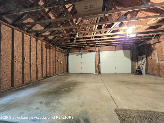 4423 Hyatt St, Eaton Rapids, MI 48827 - garage featuring a garage door opener