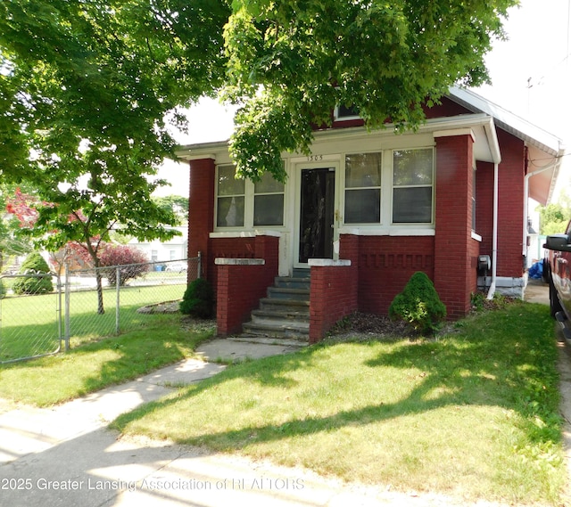 1305 May St, Lansing, MI 48906 - view of front of house featuring brick siding and entry steps