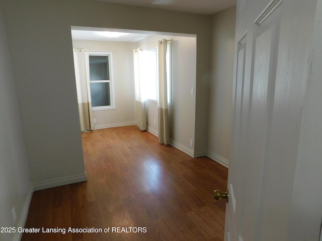 1305 May St, Lansing, MI 48906 - empty room featuring wood finished floors and baseboards
