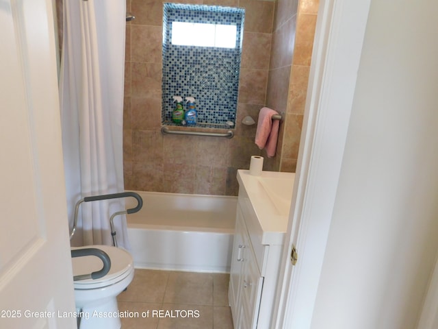 1305 May St, Lansing, MI 48906 - bathroom with tile patterned flooring, vanity, toilet, and shower / bathtub combination with curtain