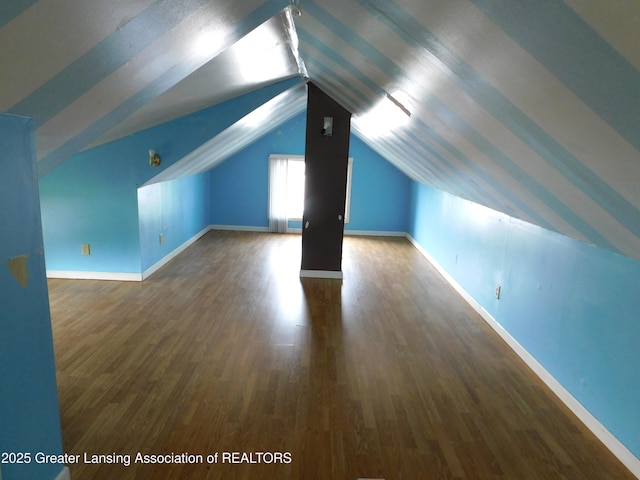 1305 May St, Lansing, MI 48906 - bonus room with vaulted ceiling, wood finished floors, and baseboards