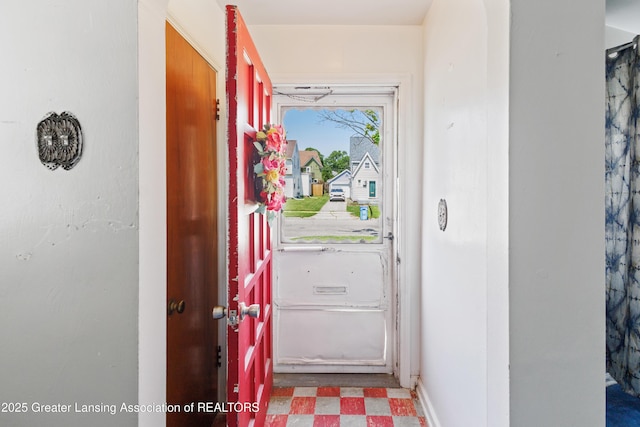1615 Inverness Ave, Lansing, MI 48915 - doorway to outside featuring tile patterned floors