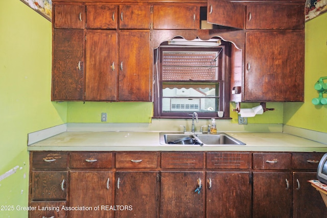 1615 Inverness Ave, Lansing, MI 48915 - kitchen featuring a sink and light countertops