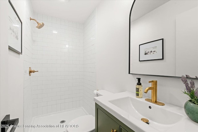 1424 Cedarhill Dr, East Lansing, MI 48823 - bathroom featuring vanity, a stall shower, and toilet