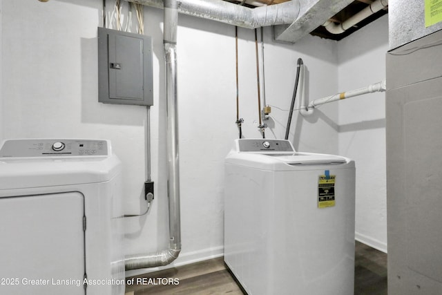 4003 Norfolk Ct, Lansing, MI 48910 - washroom with electric panel, washing machine and dryer, baseboards, and wood finished floors