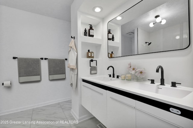 4003 Norfolk Ct, Lansing, MI 48910 - full bath with marble finish flooring, double vanity, baseboards, and recessed lighting