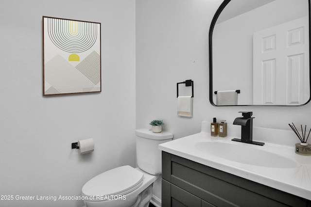 4003 Norfolk Ct, Lansing, MI 48910 - bathroom featuring toilet and vanity