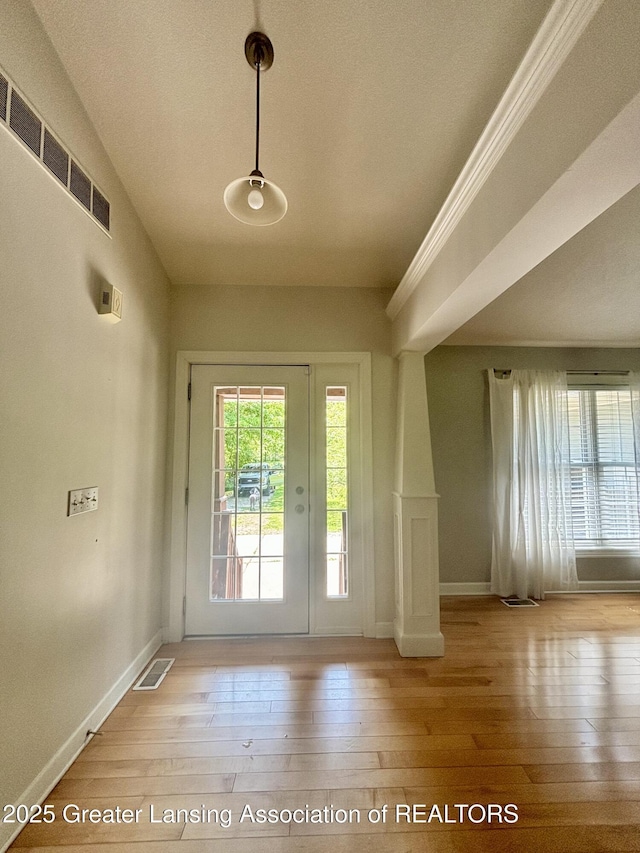 1826 Battle Creek Rd, Charlotte, MI 48813 - entryway with hardwood / wood-style flooring, baseboards, and a textured ceiling