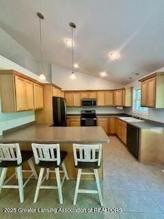 1826 Battle Creek Rd, Charlotte, MI 48813 - kitchen with stove, stainless steel microwave, a peninsula, refrigerator, and vaulted ceiling