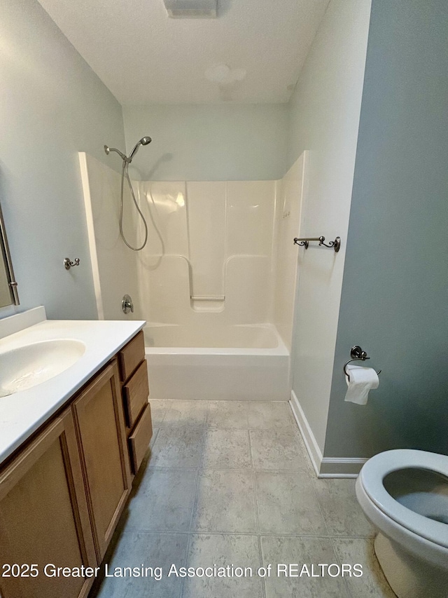 1826 Battle Creek Rd, Charlotte, MI 48813 - full bath with toilet, washtub / shower combination, vanity, and baseboards