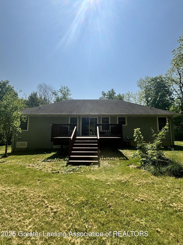 1826 Battle Creek Rd, Charlotte, MI 48813 - rear view of house featuring a deck and a lawn