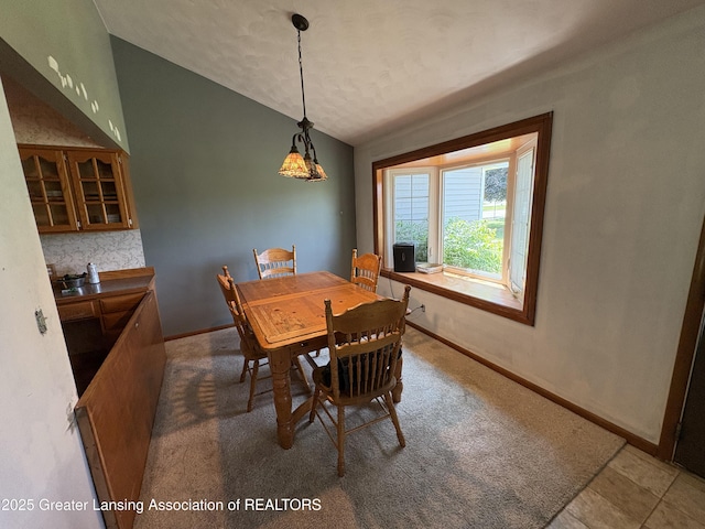 1064 W Shepherd St, Charlotte, MI 48813 - dining area with baseboards and vaulted ceiling