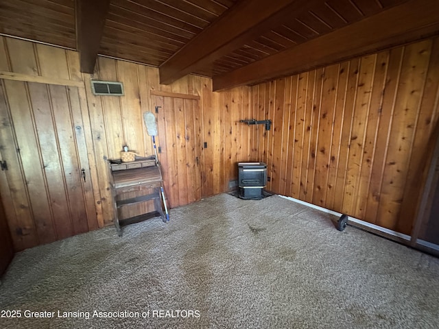 1064 W Shepherd St, Charlotte, MI 48813 - empty room with carpet, wooden walls, and wooden ceiling with exposed beams