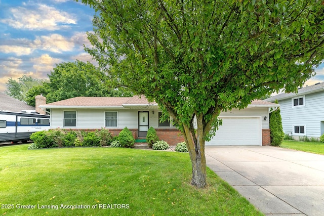 1005 Old Erin Way, Lansing, MI 48917 - view of front of property featuring brick siding, driveway, a garage, and a front lawn