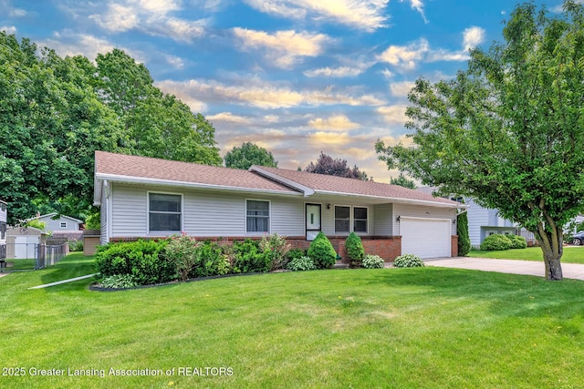 1005 Old Erin Way, Lansing, MI 48917 - ranch-style home featuring a garage, concrete driveway, and brick siding