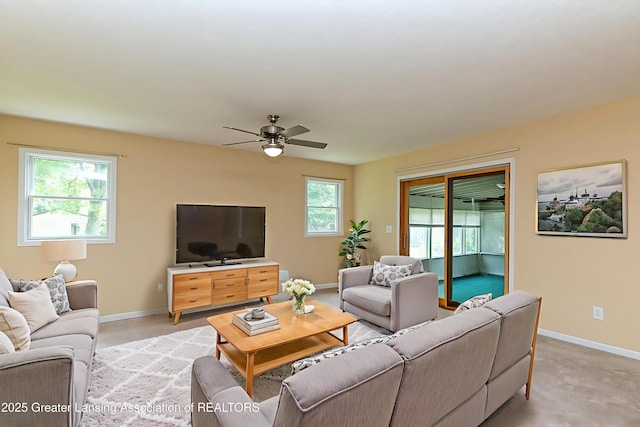 1005 Old Erin Way, Lansing, MI 48917 - living room featuring a ceiling fan and baseboards