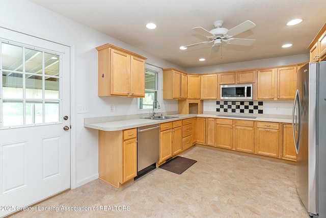 1005 Old Erin Way, Lansing, MI 48917 - kitchen featuring appliances with stainless steel finishes, a sink, a ceiling fan, light countertops, and recessed lighting