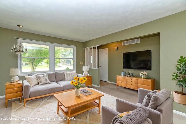 1005 Old Erin Way, Lansing, MI 48917 - living area with baseboards, a chandelier, and light colored carpet
