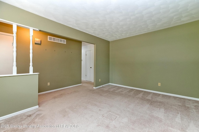 1005 Old Erin Way, Lansing, MI 48917 - spare room with light colored carpet and baseboards