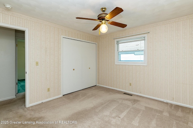 1005 Old Erin Way, Lansing, MI 48917 - unfurnished bedroom with carpet floors, a closet, and a ceiling fan