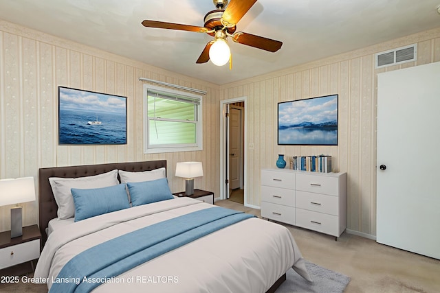 1005 Old Erin Way, Lansing, MI 48917 - bedroom featuring light colored carpet, ceiling fan, and wallpapered walls