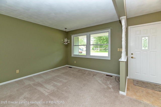 1005 Old Erin Way, Lansing, MI 48917 - carpeted foyer entrance with baseboards