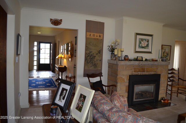 408 Whitehills Dr, East Lansing, MI 48823 - living room featuring a stone fireplace and ornamental molding