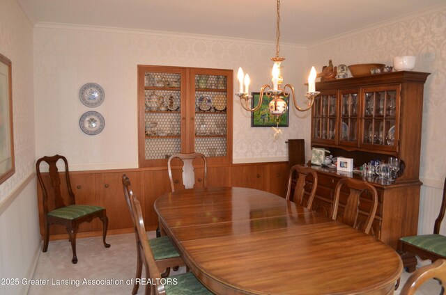 408 Whitehills Dr, East Lansing, MI 48823 - dining room with a chandelier, wainscoting, wallpapered walls, wood walls, and carpet flooring