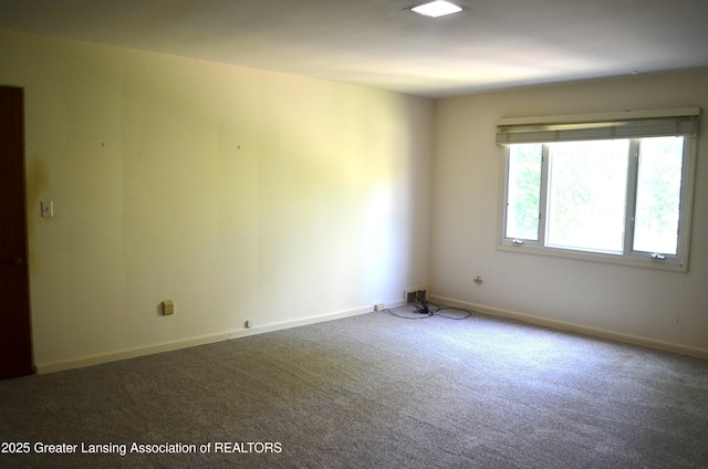 408 Whitehills Dr, East Lansing, MI 48823 - spare room featuring carpet floors and baseboards