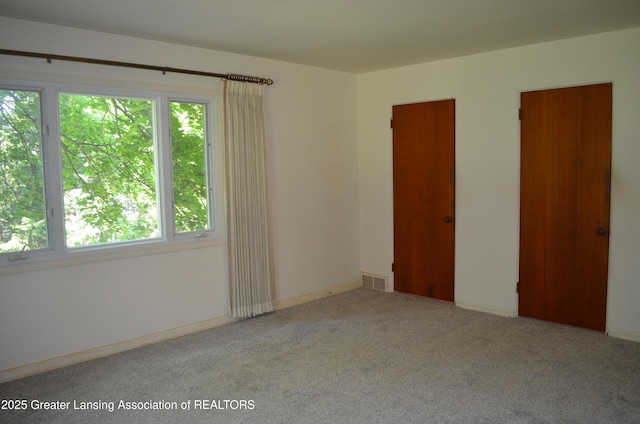 408 Whitehills Dr, East Lansing, MI 48823 - carpeted spare room featuring healthy amount of natural light