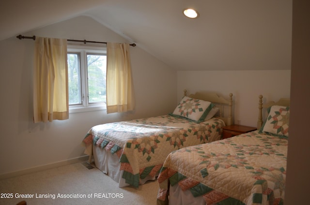 408 Whitehills Dr, East Lansing, MI 48823 - bedroom with lofted ceiling and carpet flooring