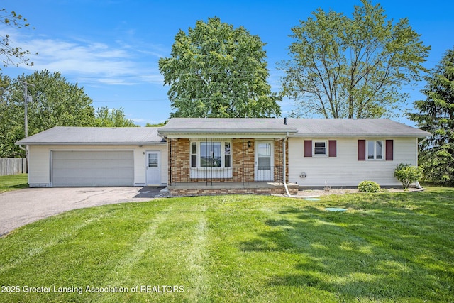 470 N New Lothrop Rd, Lennon, MI 48449 - single story home featuring asphalt driveway, a porch, a garage, and a front lawn
