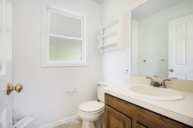 1321 Saint James Pl, Chelsea, MI 48118 - half bath with toilet, vanity, tile patterned flooring, and baseboards