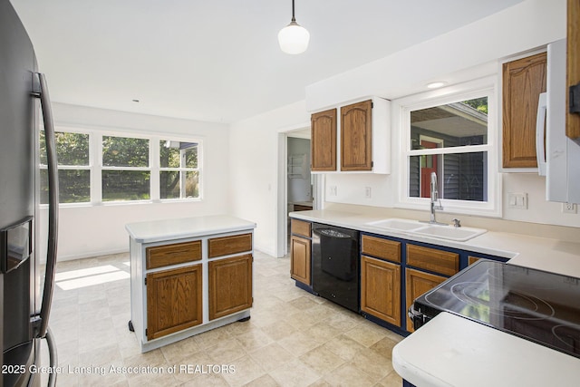 1321 Saint James Pl, Chelsea, MI 48118 - kitchen with dishwasher, stainless steel fridge, a sink, electric range oven, and light countertops