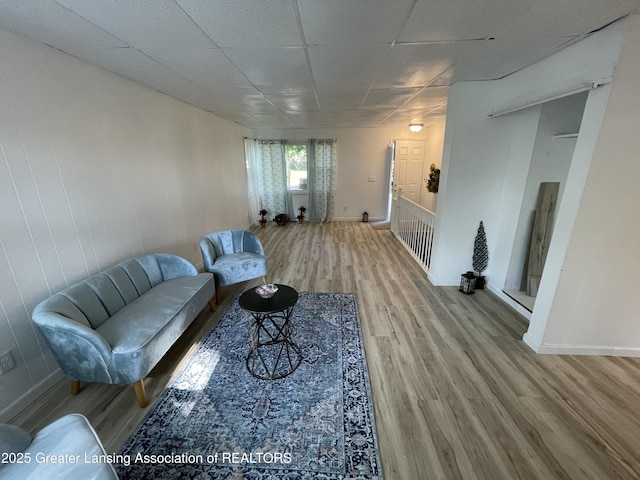 4208 Richmond St, Lansing, MI 48911 - living area featuring wood finished floors, baseboards, and a paneled ceiling