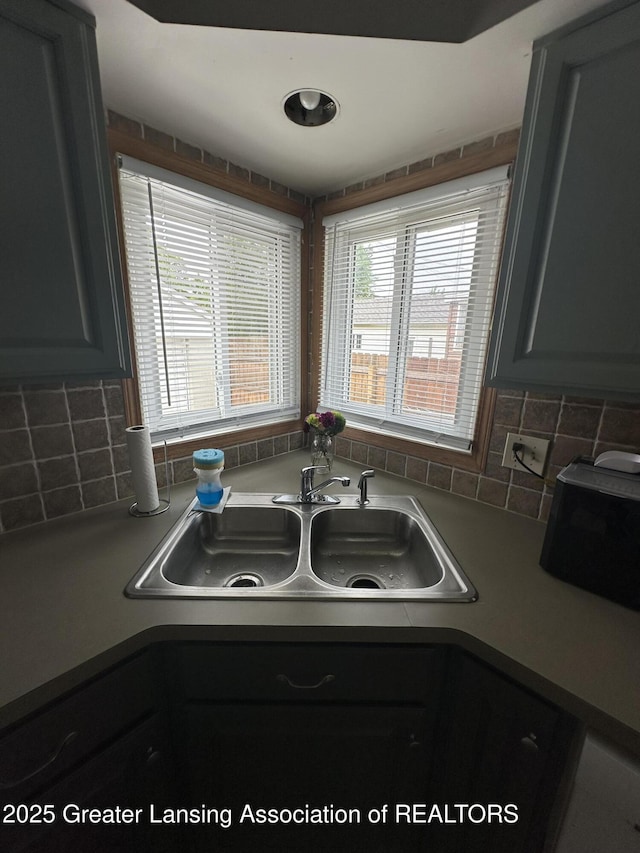 2107 Westbury Rd, Lansing, MI 48906 - kitchen view of a sink and decorative backsplash