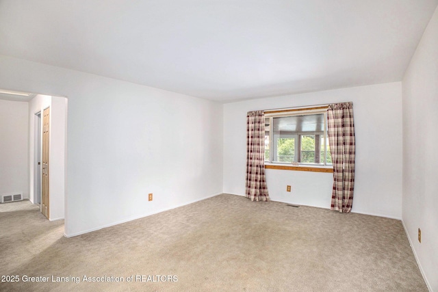 4425 Doncaster Ave, Holt, MI 48842 - spare room with carpet flooring