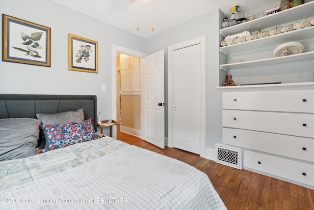 1928 Teel Ave, Lansing, MI 48910 - bedroom featuring hardwood / wood-style flooring and baseboards