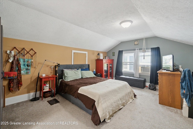1928 Teel Ave, Lansing, MI 48910 - bedroom with carpet, lofted ceiling, a textured ceiling, baseboards, and cooling unit