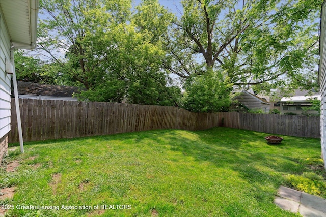 1928 Teel Ave, Lansing, MI 48910 - view of yard with an outdoor fire pit