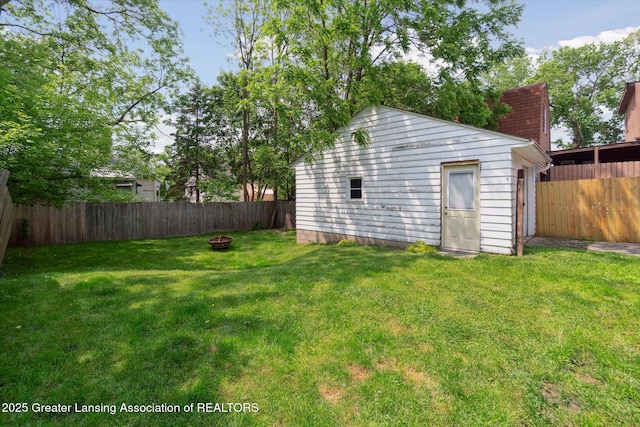 1928 Teel Ave, Lansing, MI 48910 - view of yard featuring a fire pit and an outdoor structure