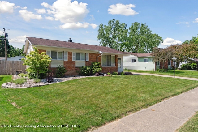 4663 Sycamore St, Holt, MI 48842 - single story home featuring brick siding
