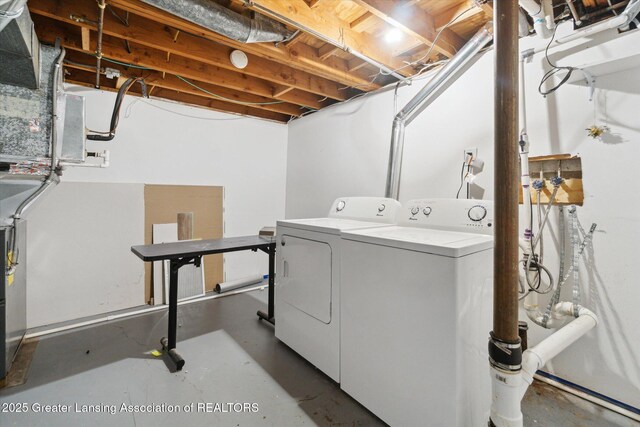 4663 Sycamore St, Holt, MI 48842 - laundry area featuring separate washer and dryer