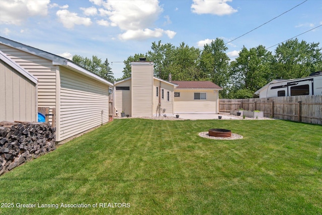 4663 Sycamore St, Holt, MI 48842 - view of yard featuring an outdoor fire pit