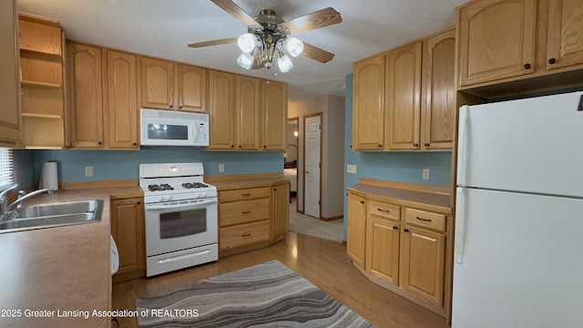 9216 S Grove Rd, Dewitt, MI 48820 - kitchen featuring white appliances, a sink, light brown cabinetry, light wood-style flooring, and ceiling fan