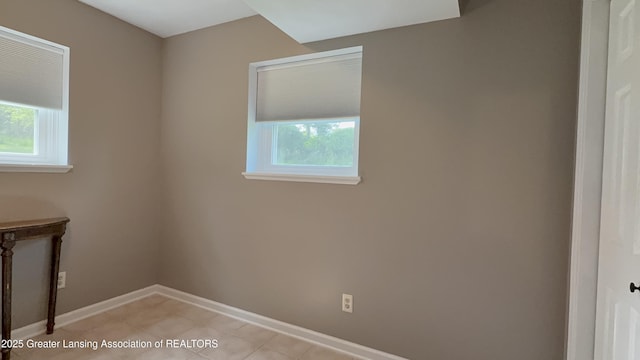 9216 S Grove Rd, Dewitt, MI 48820 - spare room featuring healthy amount of natural light, baseboards, and light tile patterned floors