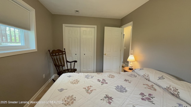 9216 S Grove Rd, Dewitt, MI 48820 - bedroom with a closet and baseboards